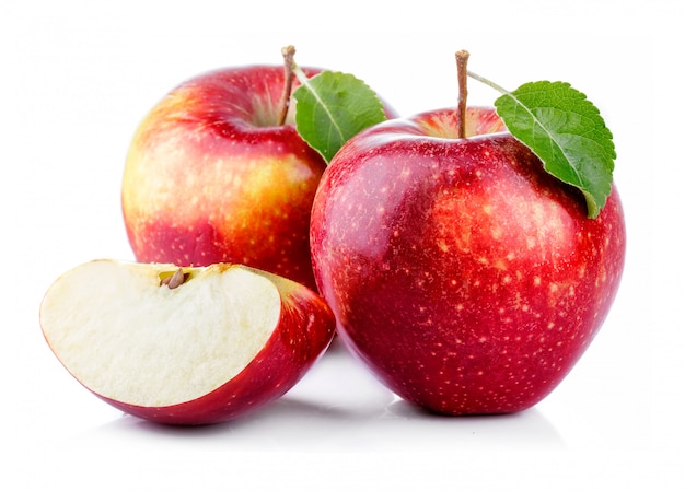 Red apples with leaf and slice isolated on a white