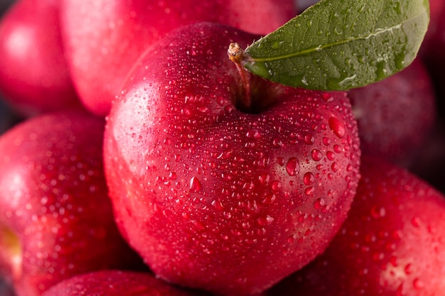 Red apples with leaves on the table