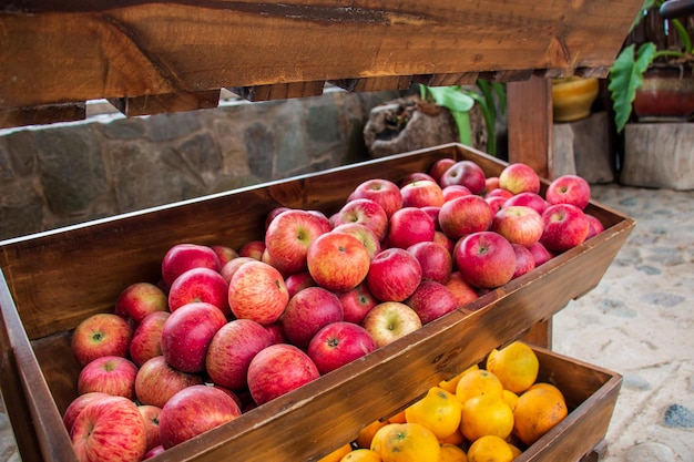 Red apples in a wooden basket in a market