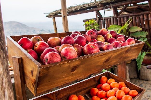 Red apples in a wooden basket in a market