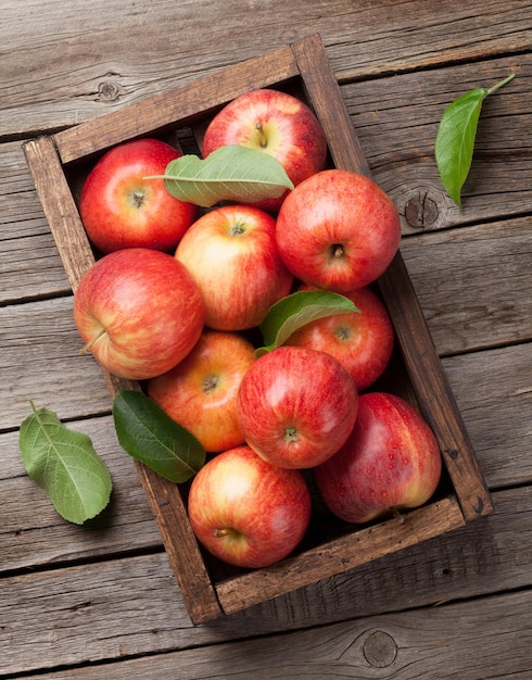 Red apples in wooden box