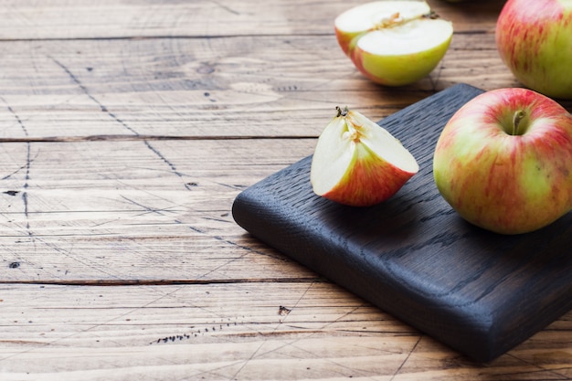 Red apples on a wooden table