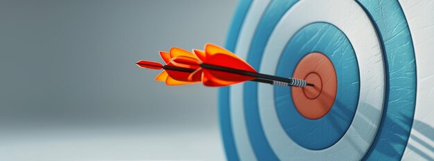 Photo red arrow striking bullseye target with blurry background