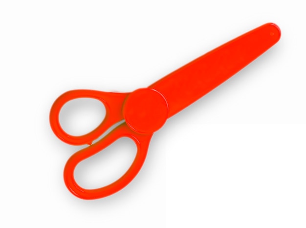 The red baby scissors cut out on a white background View from above