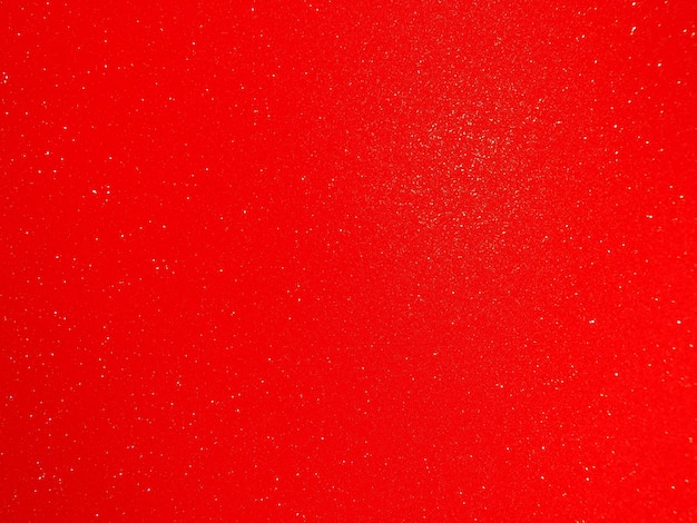 Red background arched scarlet Nice holiday color Background with shimmer gradient white dots Photograph of sparkling colored paper