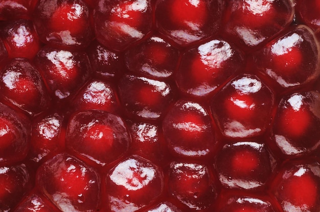 Red background from pomegranate seeds