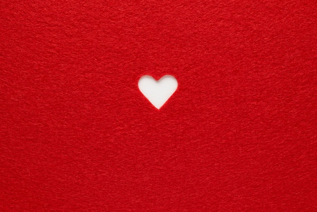 Red background with white Valentine's heart. Copy space for text