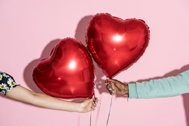 Red balloons on a pink background