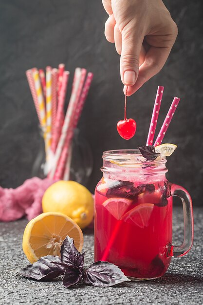 Red basil homemade lemonade in a glass jar Summer refreshing drink