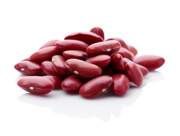 Red beans are piled up on a white surface.