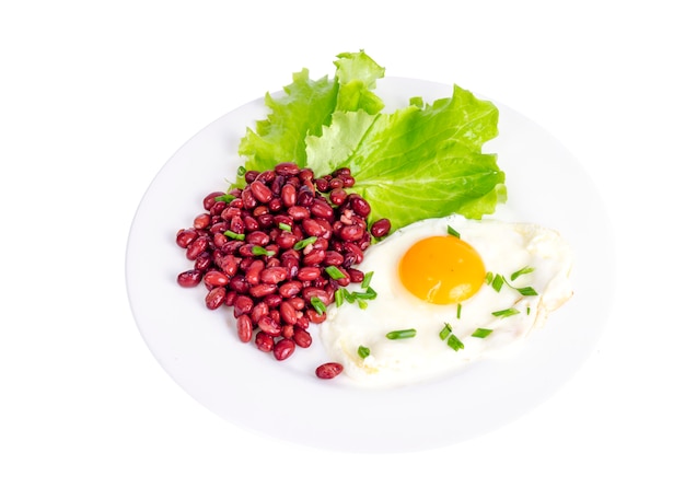 Red beans, lettuce and fried egg for breakfast.