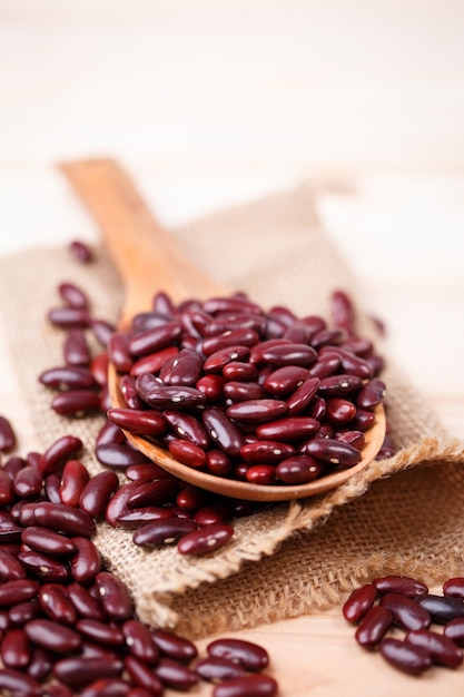 Red beans in wooden spoon