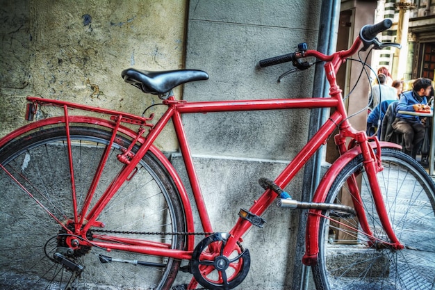 Red bicycle against a wall in Florence Italy