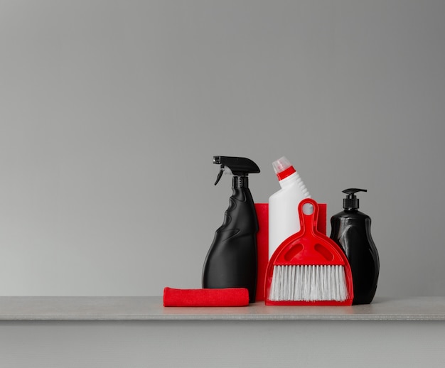 Red and black cleaning kit - scoop and broom, cloths, toilet detergent, dishwashing liquid and spray 