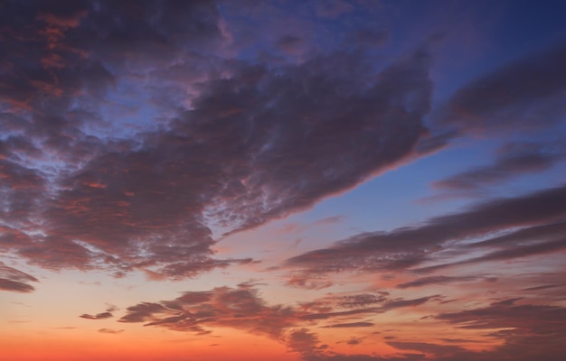 Red and blue sky with clouds at sunrise