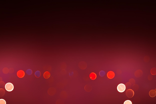 Red bokeh lights on a dark red background