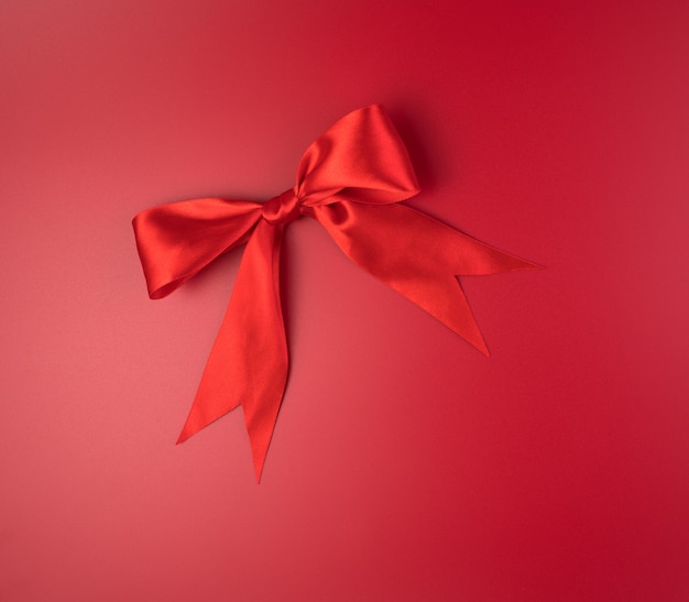 Red bow made of satin ribbon