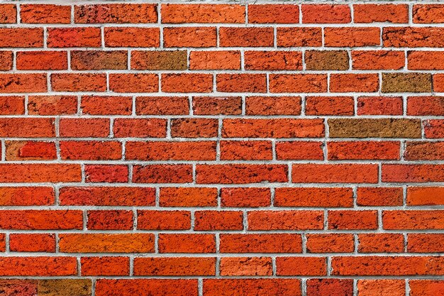 Photo red brick wall with white mortar in a horizontal pattern