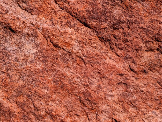 Red brown stone background Rock surface Mountain texture Closeup Bright rock background