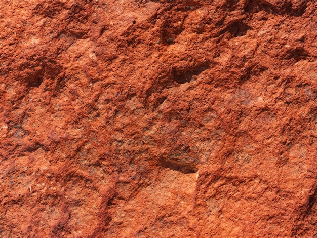 Red brown stone background Rock surface Mountain texture Closeup Bright rock background