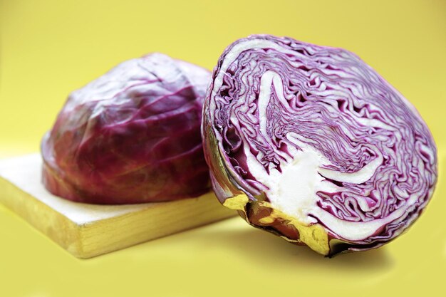 Red cabbage against yellow backgroundxA