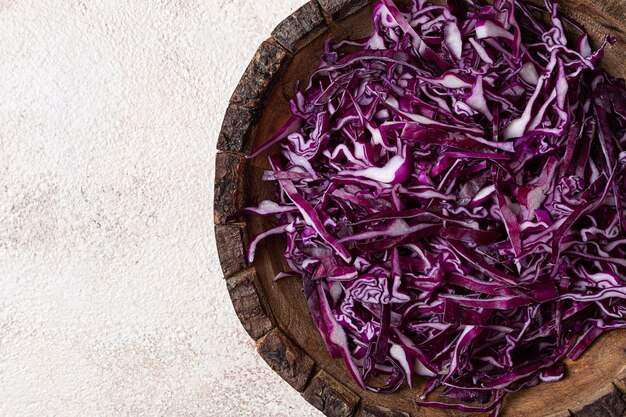 red cabbage sliced in a wooden salad bowl top view no people