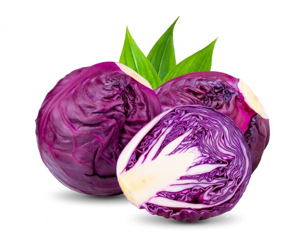 Red cabbage with leaves on white wall. 