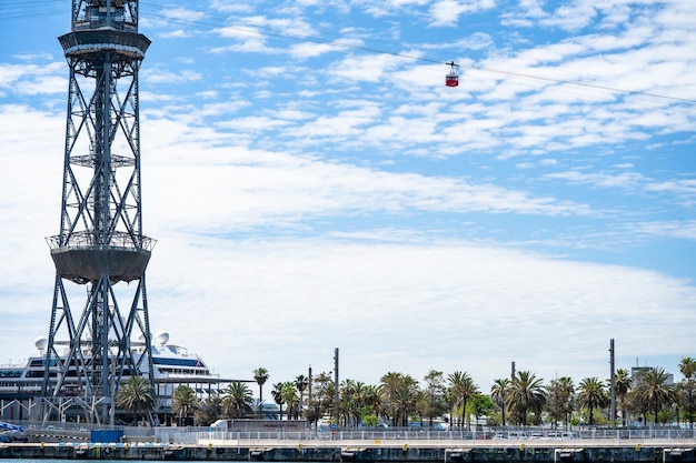 Red cable car and tower at Barcelona Port Vell Funicular to the Montjuic in Barcelona