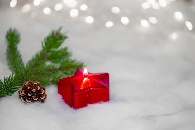 Red candle with Christmas ornament