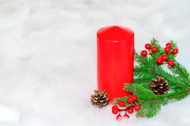 Red candle with Christmas ornament