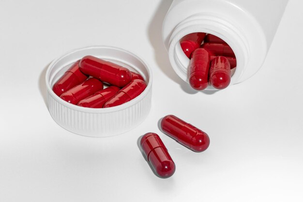 Red capsules of vitamins pills or medicine ashwagandha brahmi