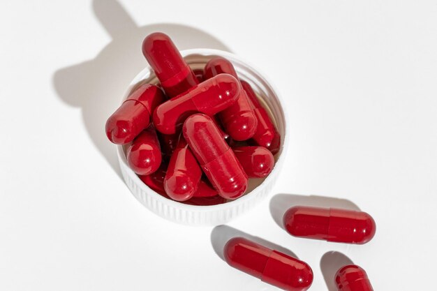 Red capsules of vitamins pills or medicine ashwagandha brahmi