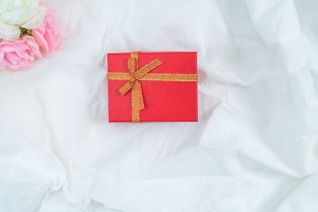 Red cardboard box for gifts and flower, isolated