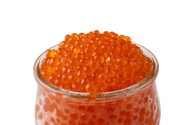 Red caviar in a glass jar, isolated