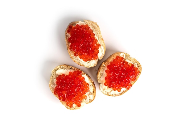 Red caviar isolated on a white background Sandwiches with red caviar High quality photo