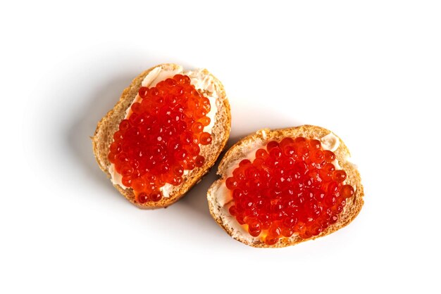 Red caviar isolated on a white background Sandwiches with red caviar High quality photo