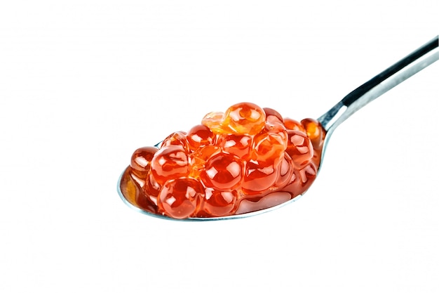 Red caviar in the silver spoon.