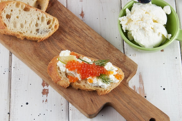 Red caviar on a wooden table bruschetta with caviar