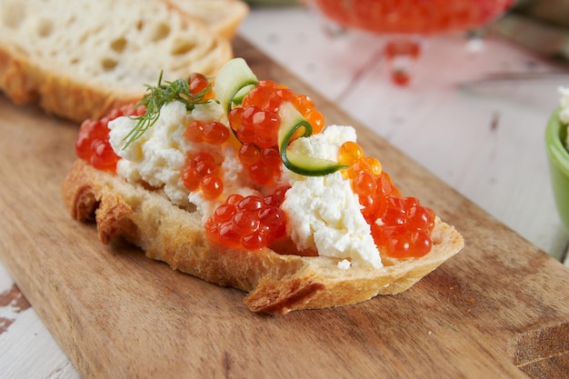 Red caviar on a wooden table bruschetta with caviar