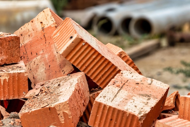 Red ceramic bricks at the construction site Keramoblock Hollow brick Construction of a red brick building Closeup Material for the construction of walls and partitions