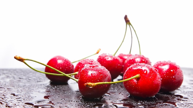 Red cherries in water drops Fresh cherries on dark background Washed cherries before cooking