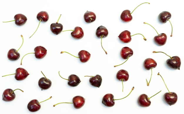 Red cherries on white background