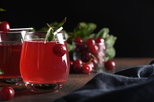 Red cherry homemade compote in glasses Summer beverage