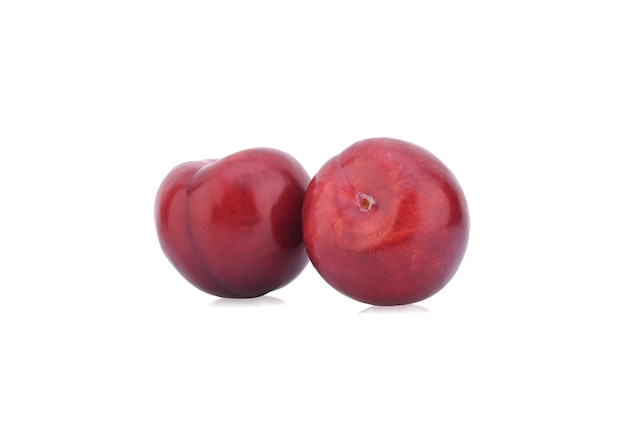 Red cherry plum isolated on white surface