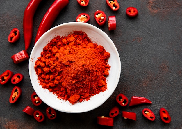 Red chili pepper, dried chillies on dark surface