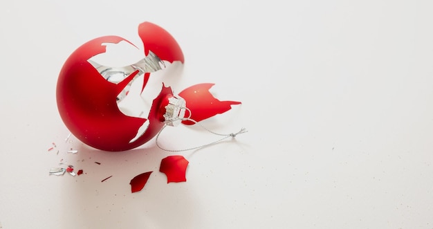 Red Christmas ball broken isolated on white background closeup view