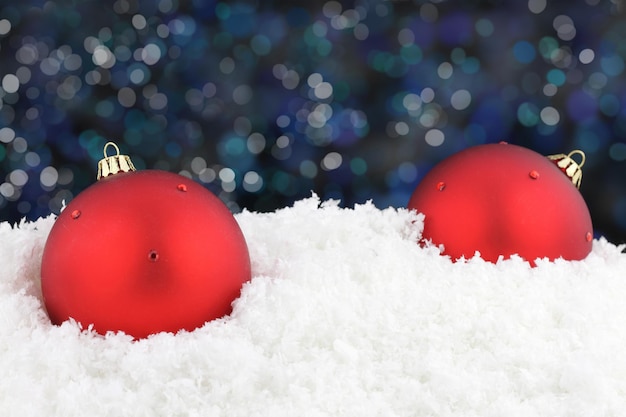 Red Christmas ball on snow