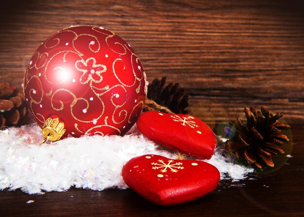 Red Christmas decorations on  snow