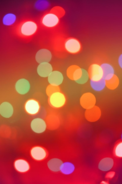 Red Christmas glitter lights background Defocused abstract red background