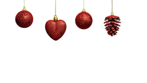 Red Christmas tree decorations hanging in a row with copy space at the bottom